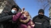 Kazakhstan. Police detain a woman during a rally. Almaty, February 28, 2021